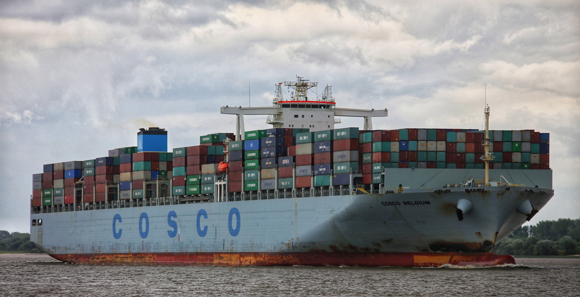 a large cargo ship with a lot of containers on it